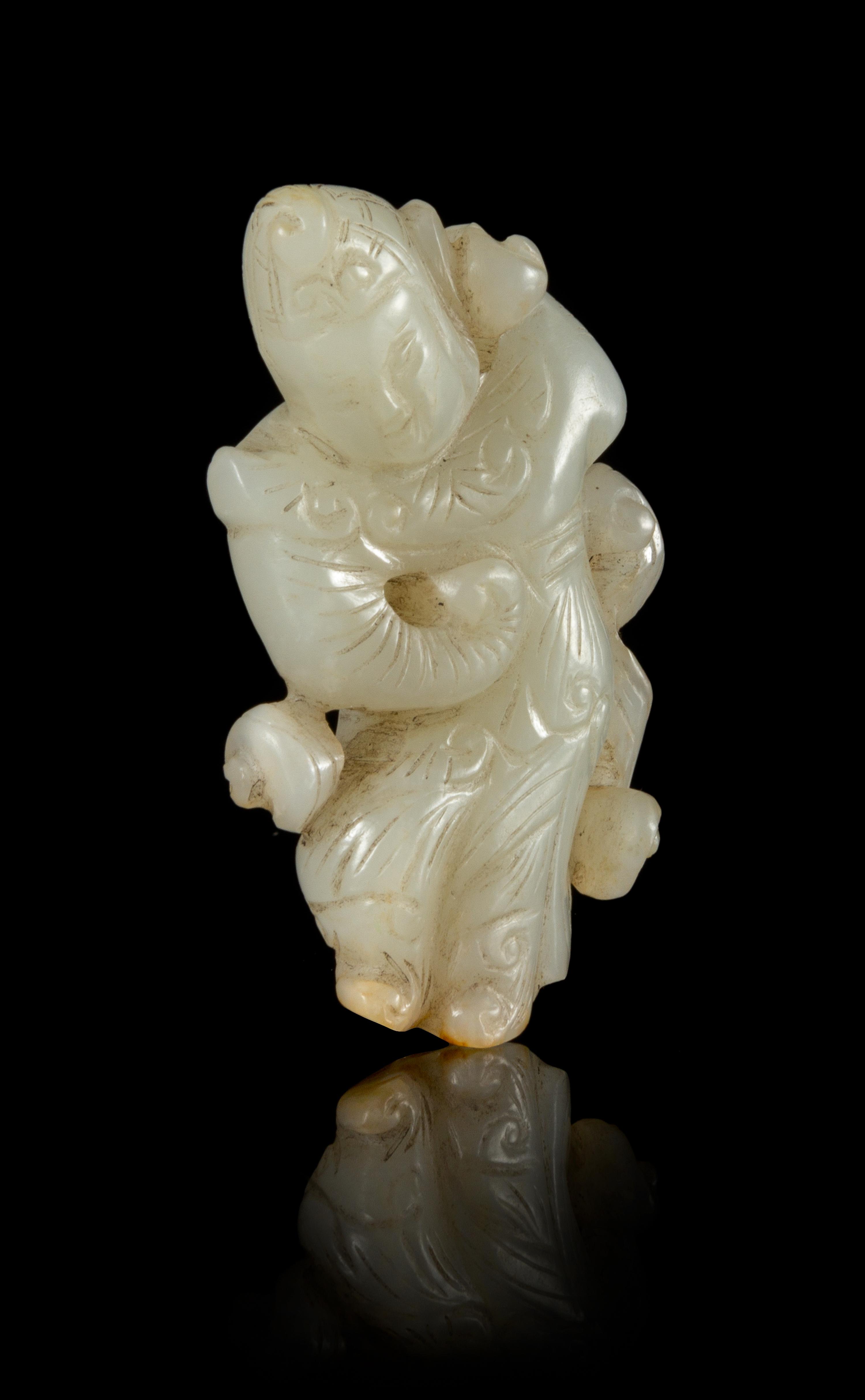 A Carved Celadon Jade Pendant Length 2 1/2 inches.