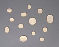 A Collection of Thirteen Plaster Medallions, Height of tallest 3 inches.