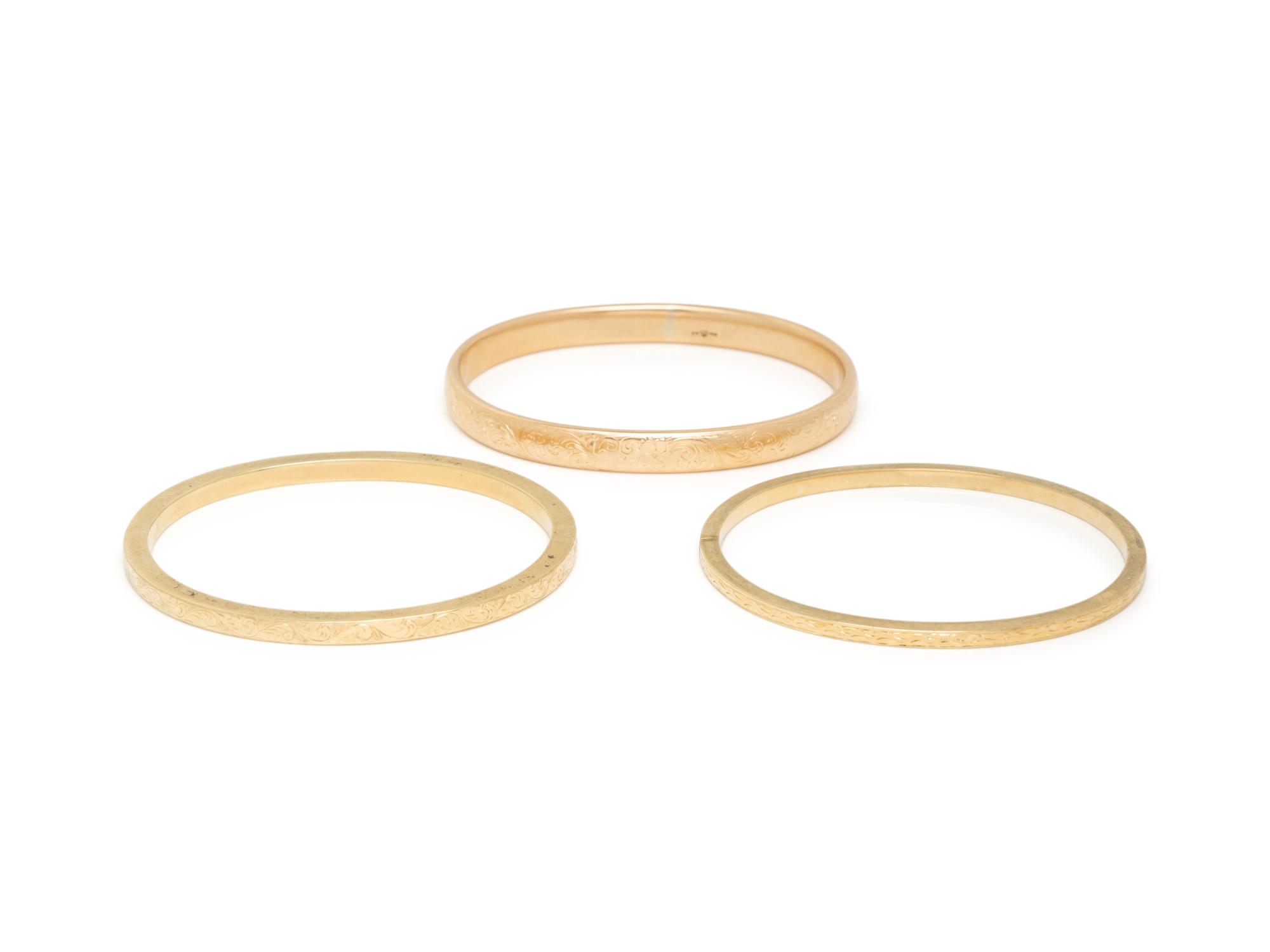 COLLECTION OF YELLOW GOLD BANGLE BRACELETS