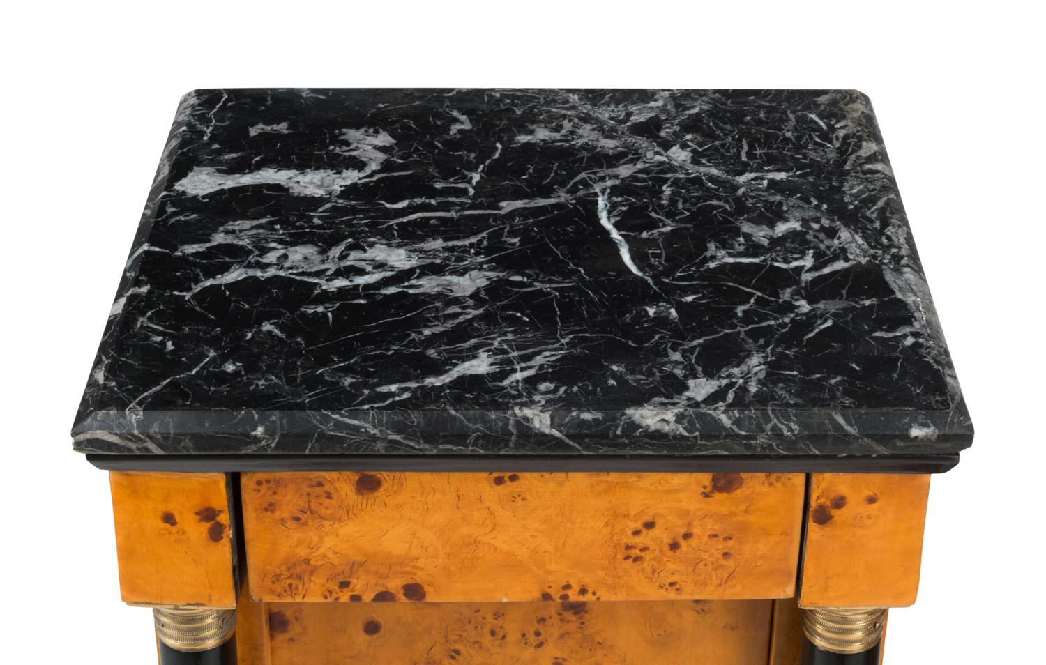 A Pair of Empire Style Part-Ebonized Marble-Top Bedside Tables