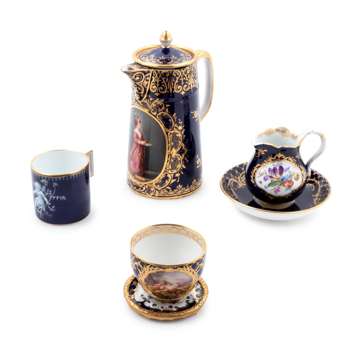 Four German Painted and Parcel Gilt Cobalt-Ground Porcelain Articles
