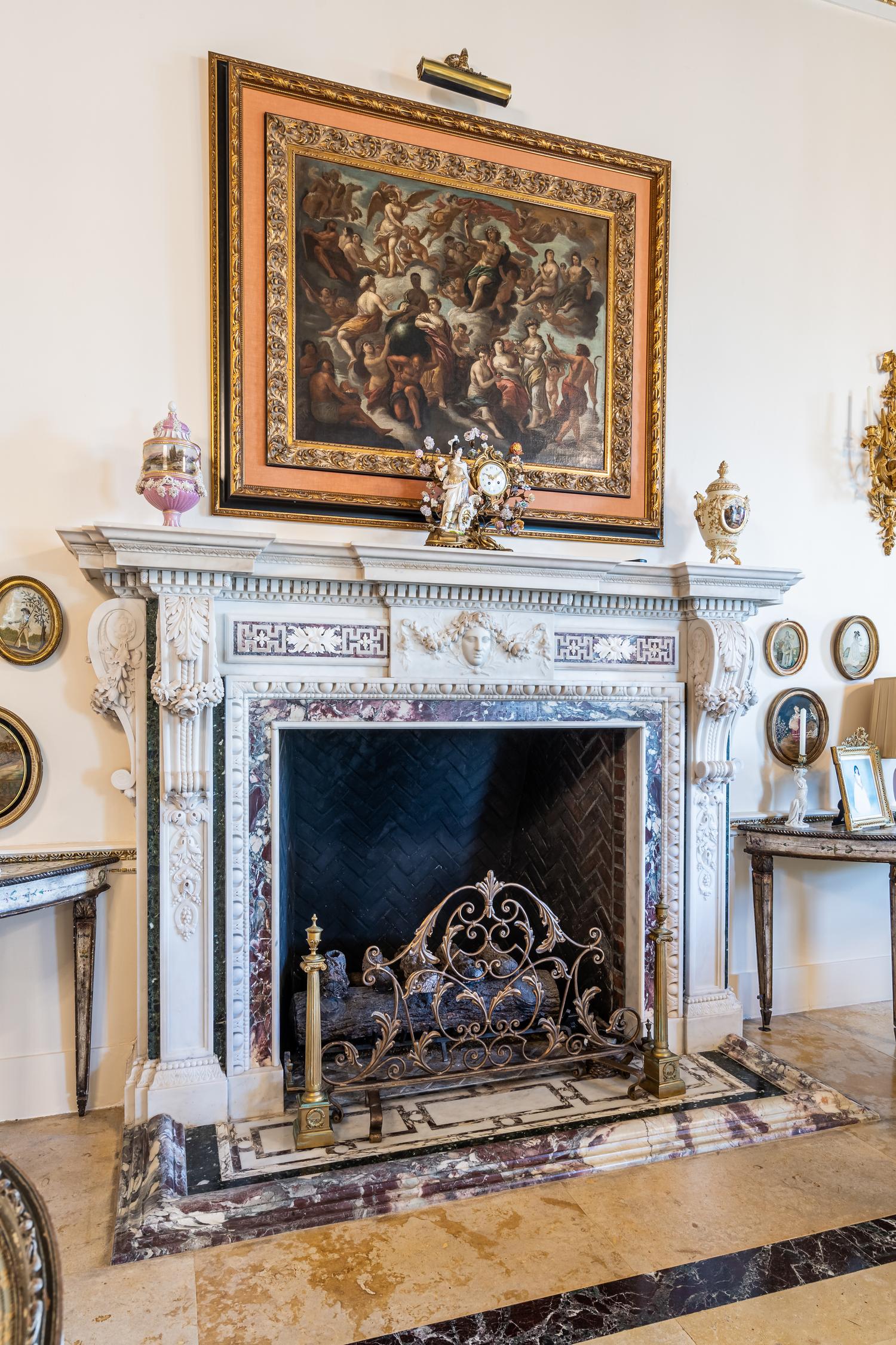 A Pair of Continental Gilt Bronze Chenets and an Associated Fire Screen
