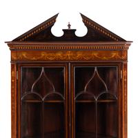 An Edwardian Fruitwood- Inlaid Mahogany Corner Cupboard