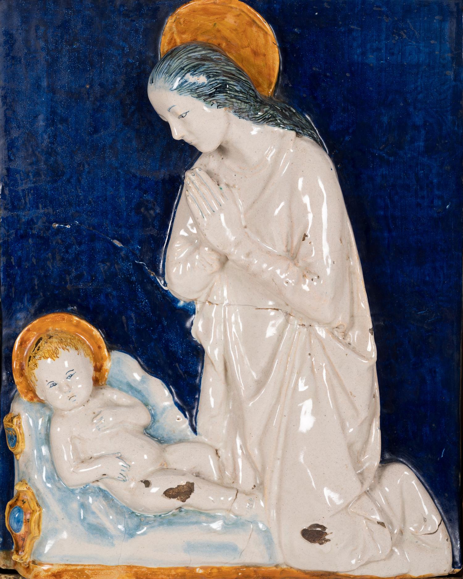 An Italian Glazed Earthenware Plaque of the Madonna and Child