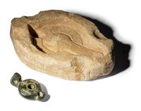 A Byzantine Black Stone Lamp with Crosses and a Byzantine Limestone Lamp Mold with a Chi Rho