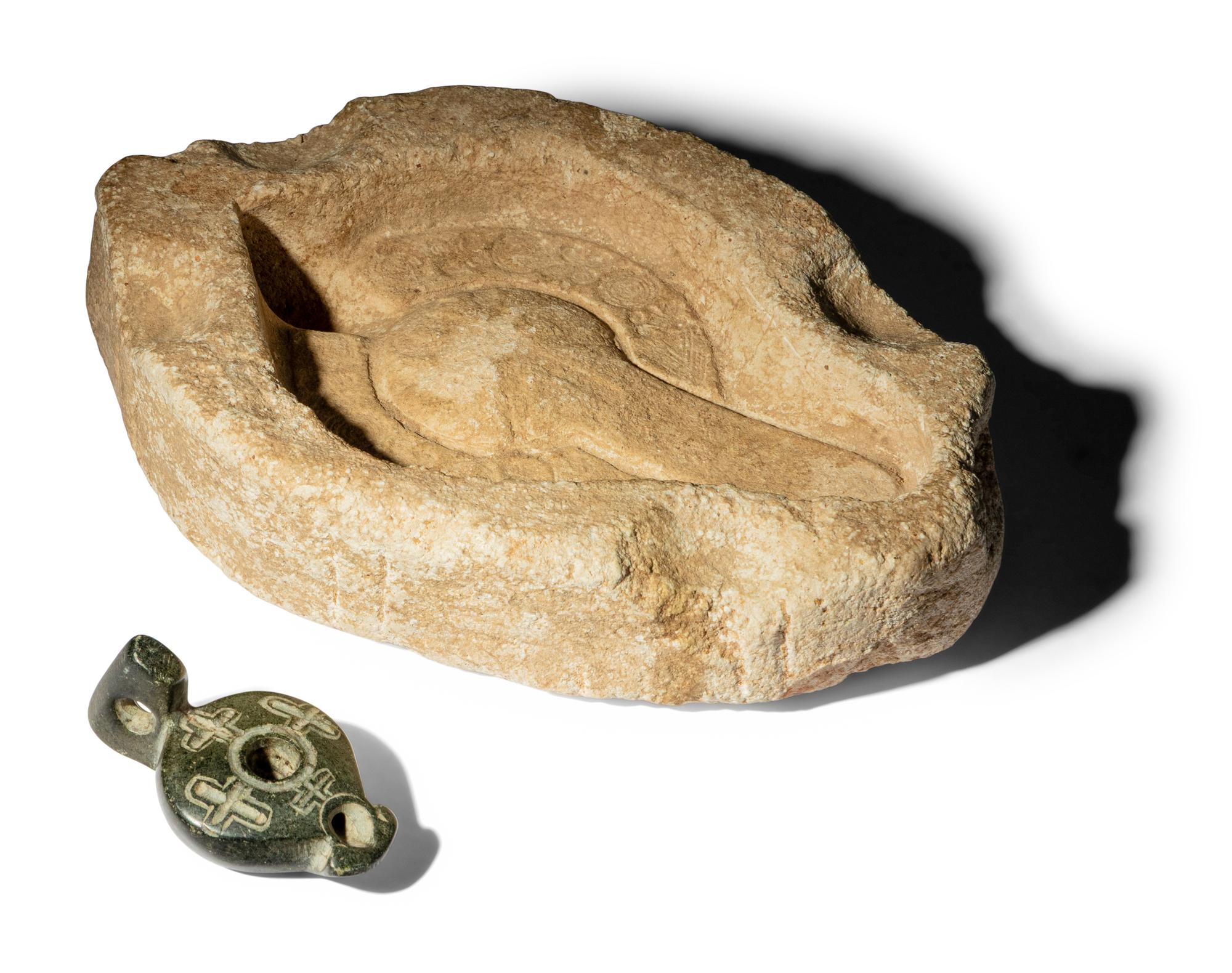 A Byzantine Black Stone Lamp with Crosses and a Byzantine Limestone Lamp Mold with a Chi Rho