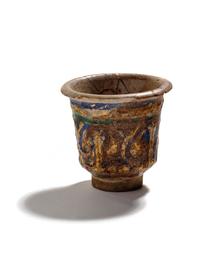An Islamic Blue, Green and Iridescent Gold Glazed Pottery Cup