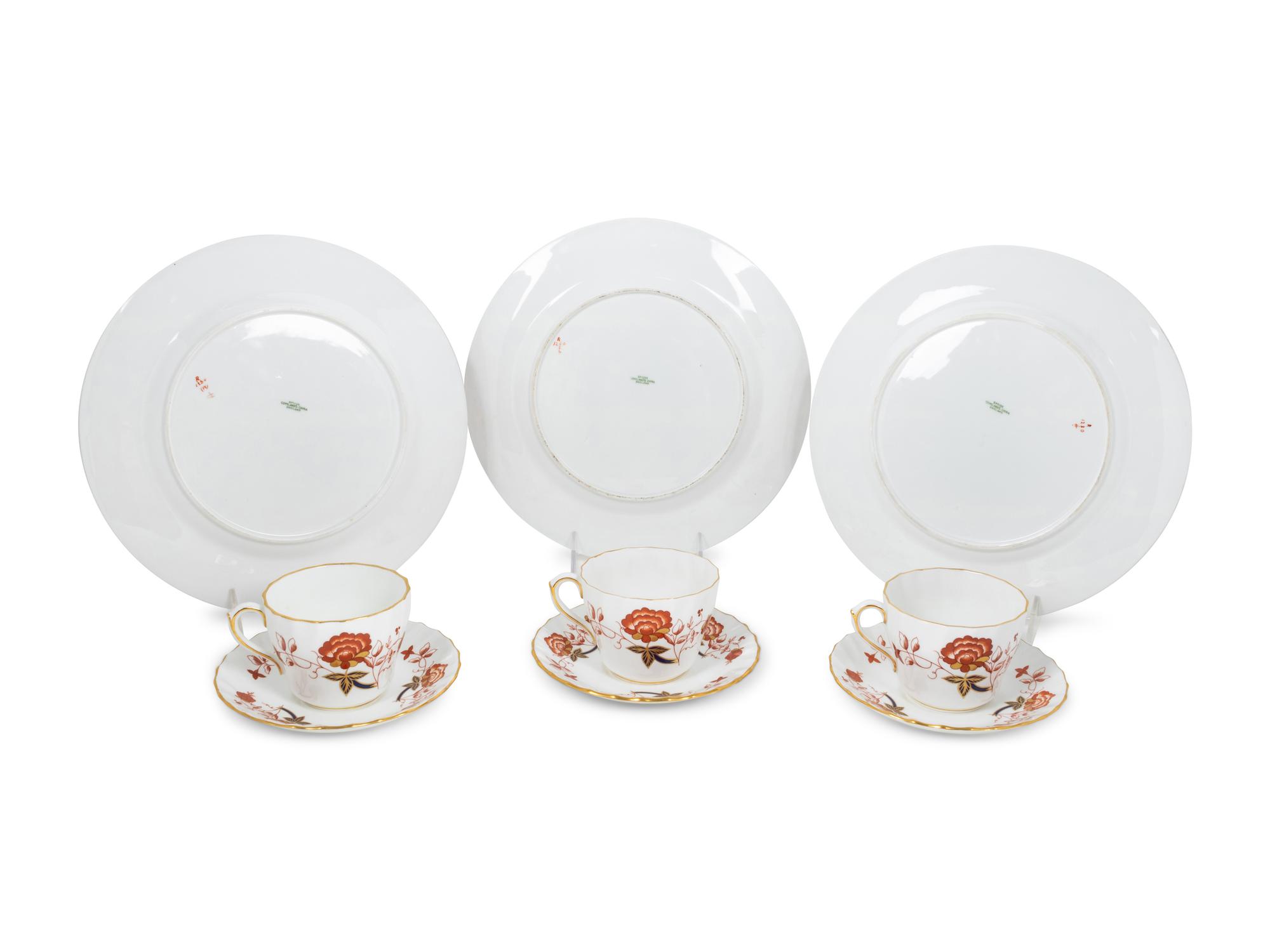 A Set of Twelve Spode Dinner Plates and a Similar Set of Royal Crown Derby Cups and Saucers
