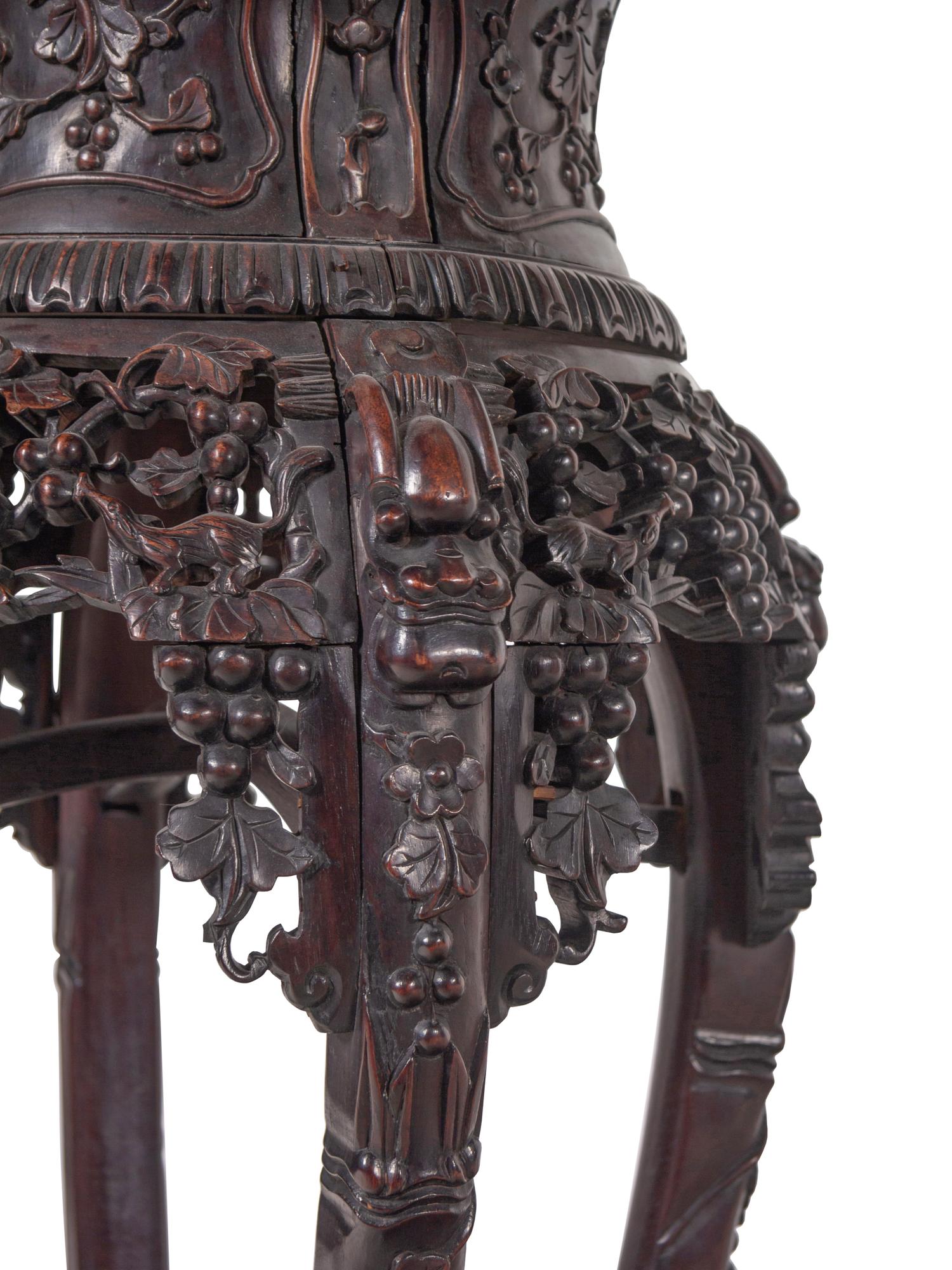 A Chinese Export Carved Hardwood Stand, Huaji