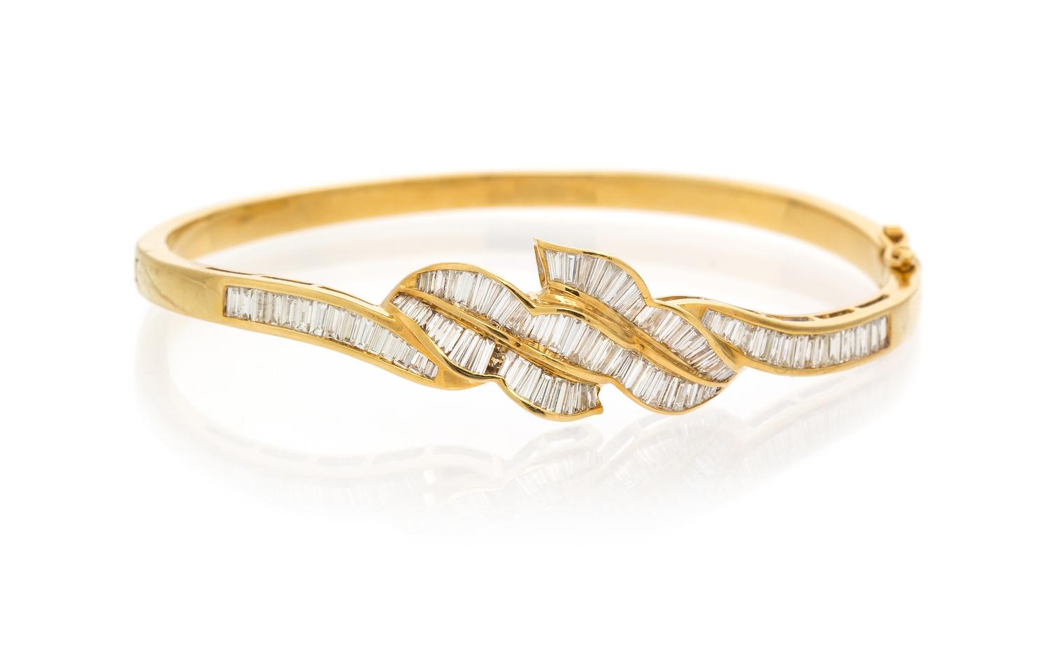 An 18 Karat Yellow Gold and Diamond Bangle Bracelet, 11.60 dwts.