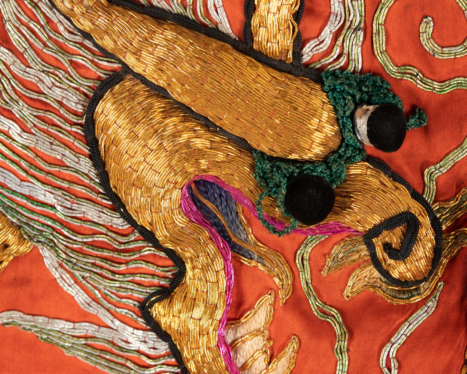 Four Chinese Orange Ground Embroidered Silk Theatrical Articles