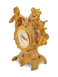 A Louis XV Style Gilt Metal Figural Clock with German Movement
