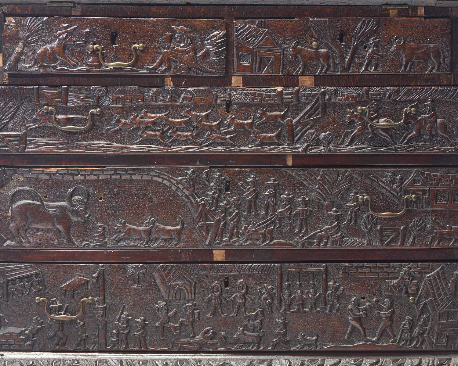 An English Relief-Carved Oak Slant-Front Desk