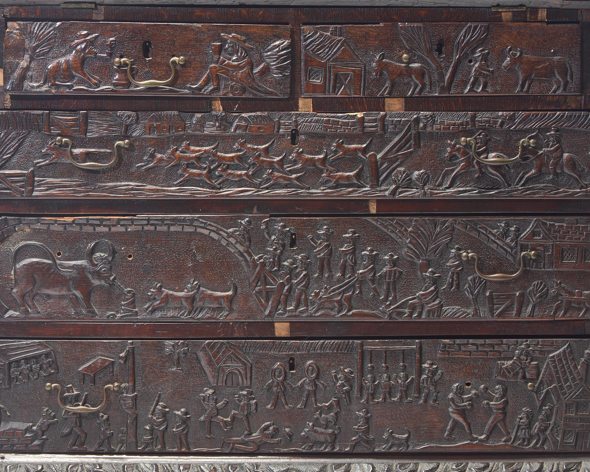 An English Relief-Carved Oak Slant-Front Desk