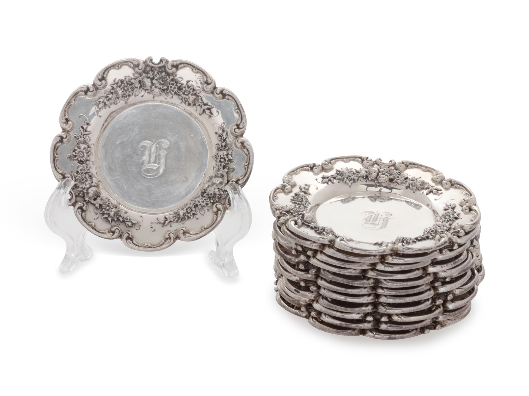 each with floral decoration, monogrammed.