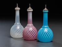 Three Opalescent Swirl Glass Barber Bottles
