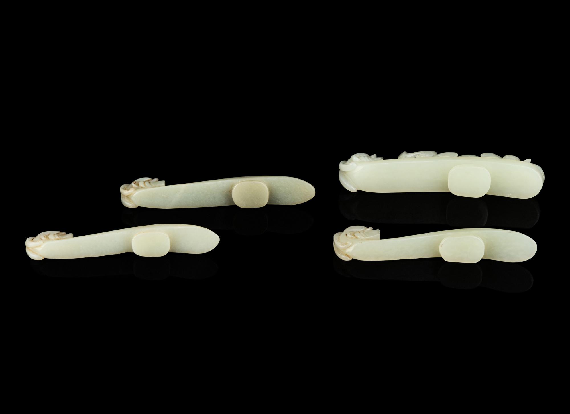 Four Chinese Celadon Jade 'Chilong' Belt Hooks