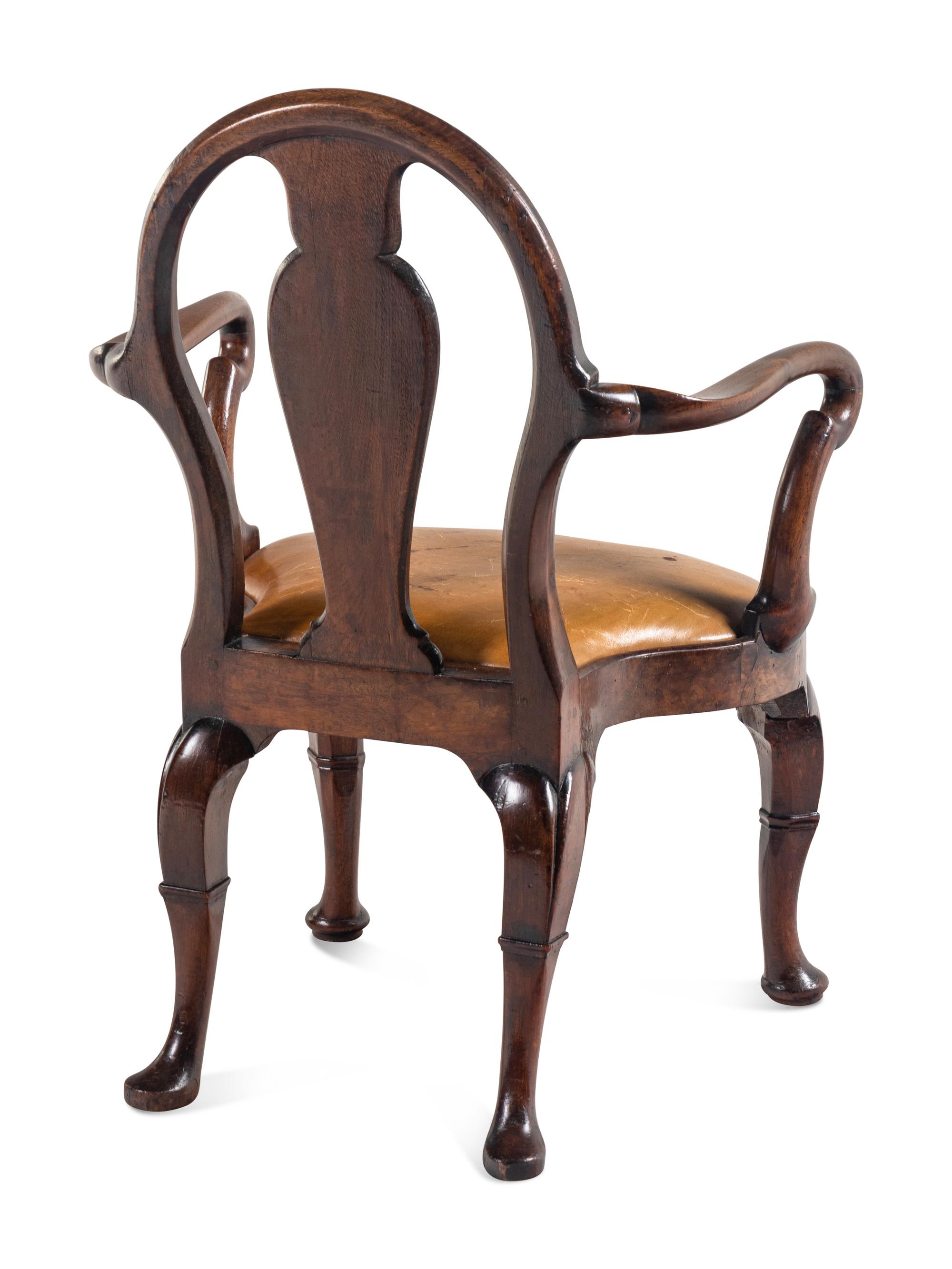 A George II Style Walnut Writing Table with an Associated Armchair
