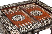 A Levantine Marquetry and Mother-of-Pearl Inlaid Flip-Top Swivel-Action Game Table
