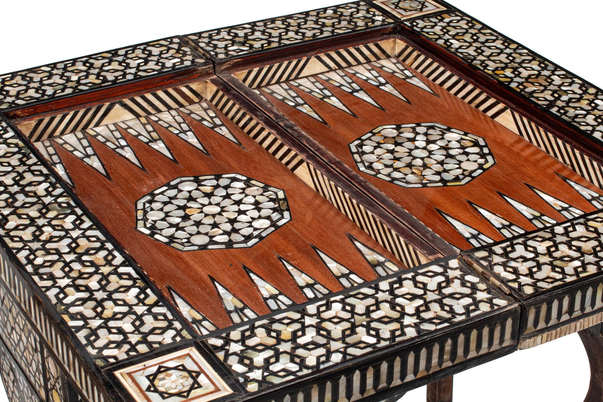A Levantine Marquetry and Mother-of-Pearl Inlaid Flip-Top Swivel-Action Game Table