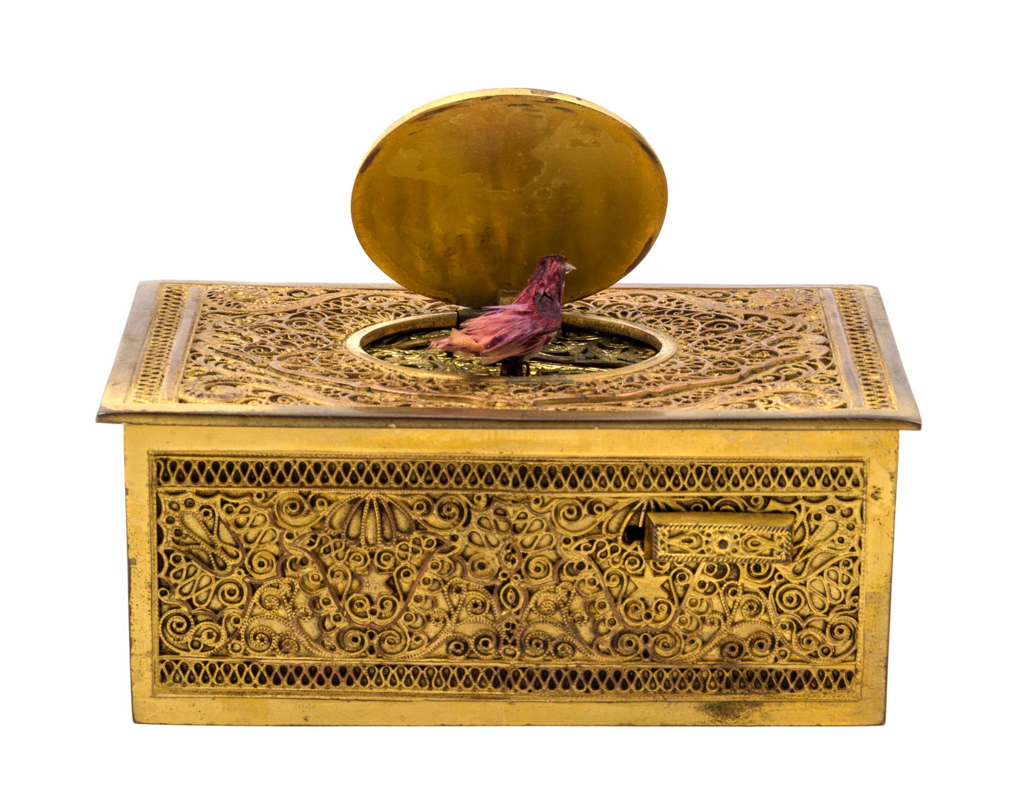 A German Gilt Filigree Singing Bird Automaton Box Width 4 1/4 inches.