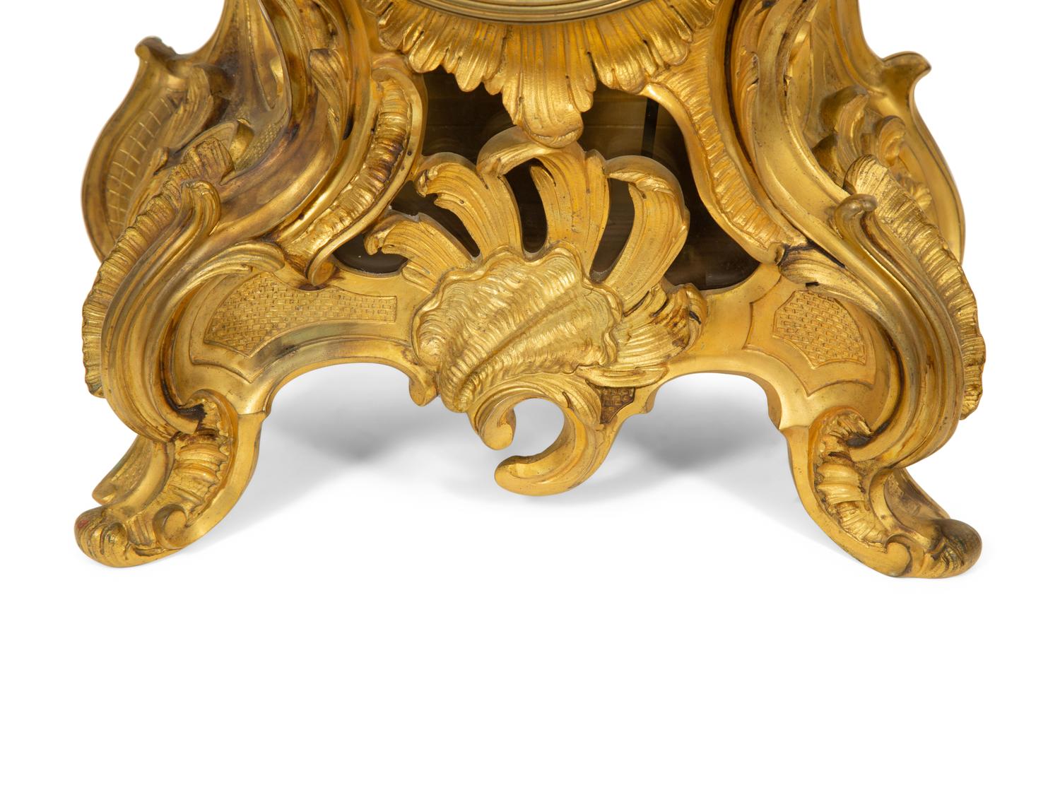 A Louis XV Style Gilt Bronze Clock Garniture