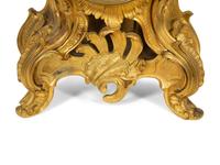 A Louis XV Style Gilt Bronze Clock Garniture