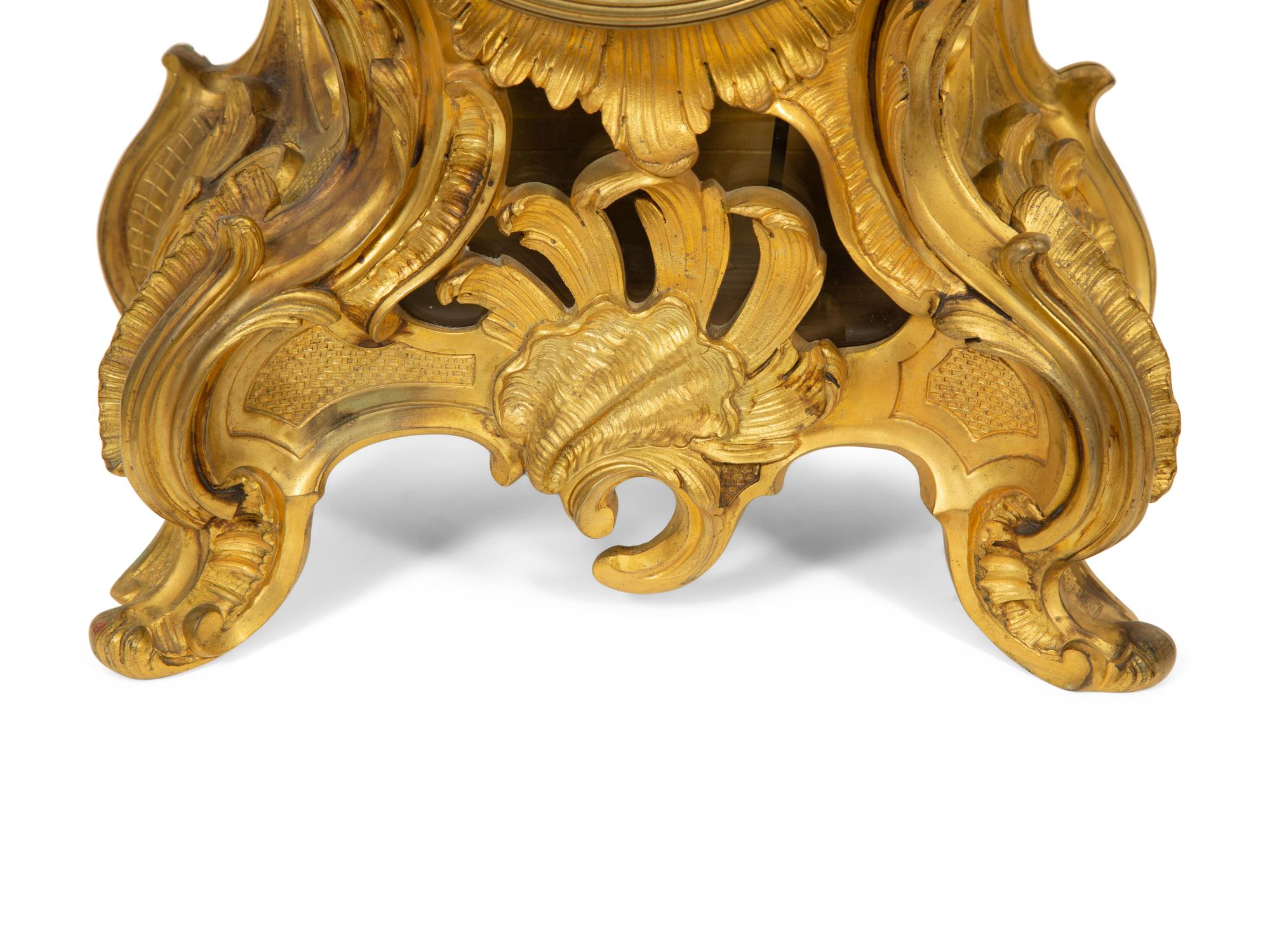 A Louis XV Style Gilt Bronze Clock Garniture