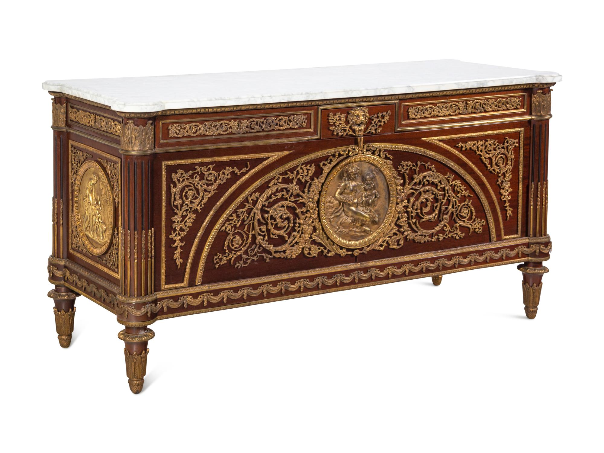 A Louis XVI Style Gilt Bronze Mounted Mahogany Marble-Top Commode à Vantaux After the Model by Guillaume Benneman