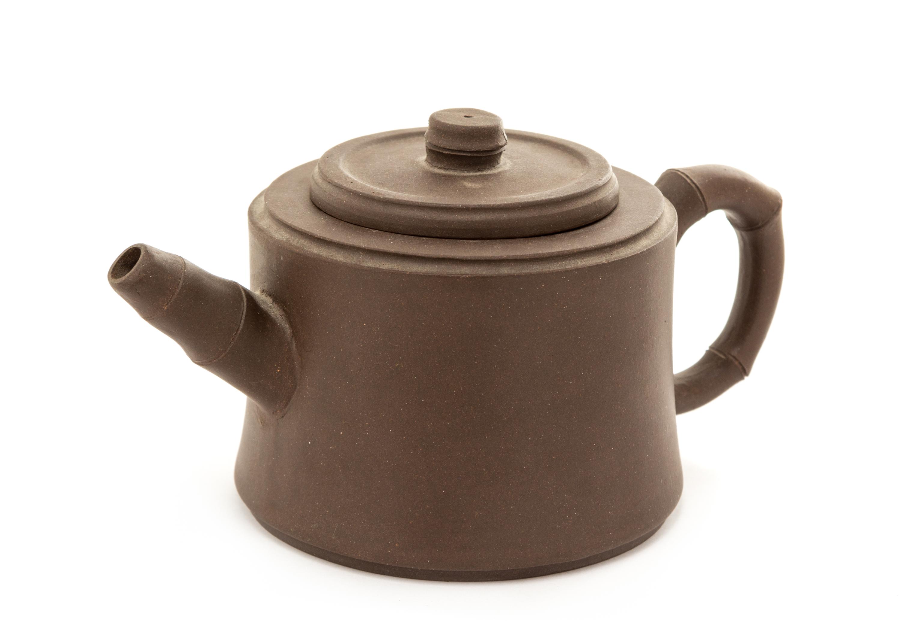 A Yixing Pottery Teapot Height 3 1/2 inches.