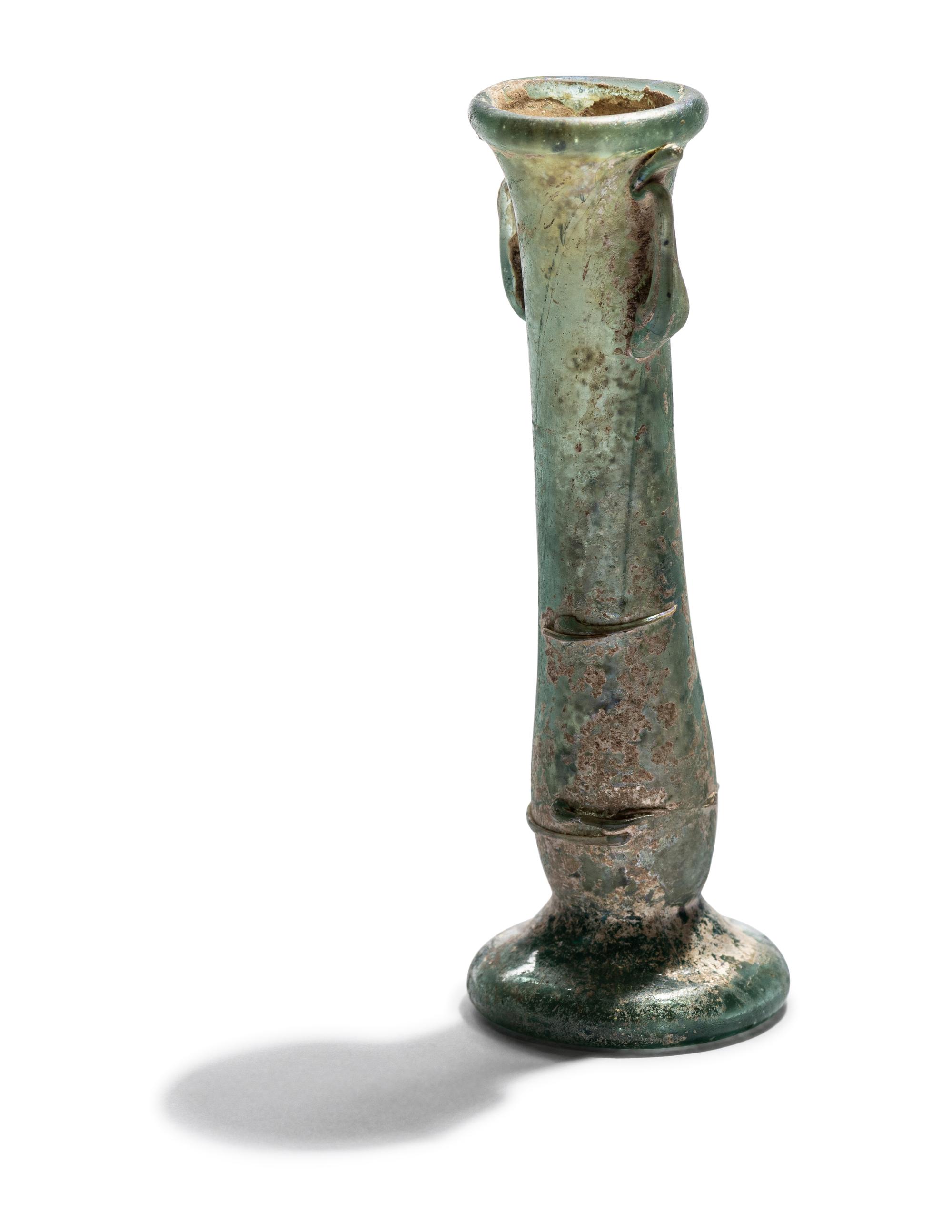 A Roman Blue Glass Unguentarium