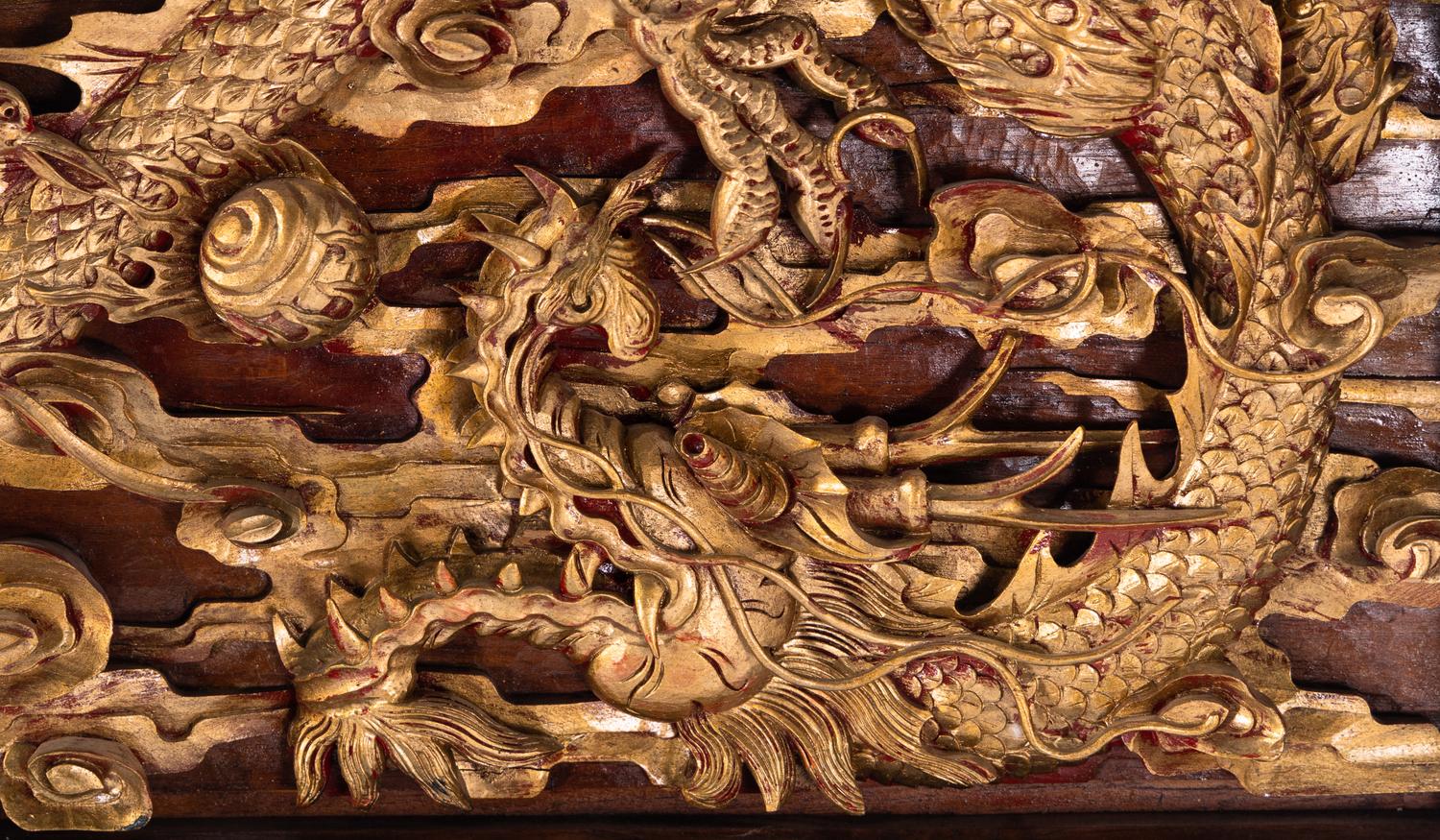 Two Chinese Gilt and Red Lacquered Wood Panels