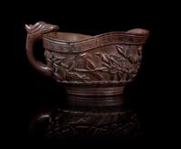 A Zitan Libation Cup Height 2 1/4 x width over handles 4 3/8 inches.