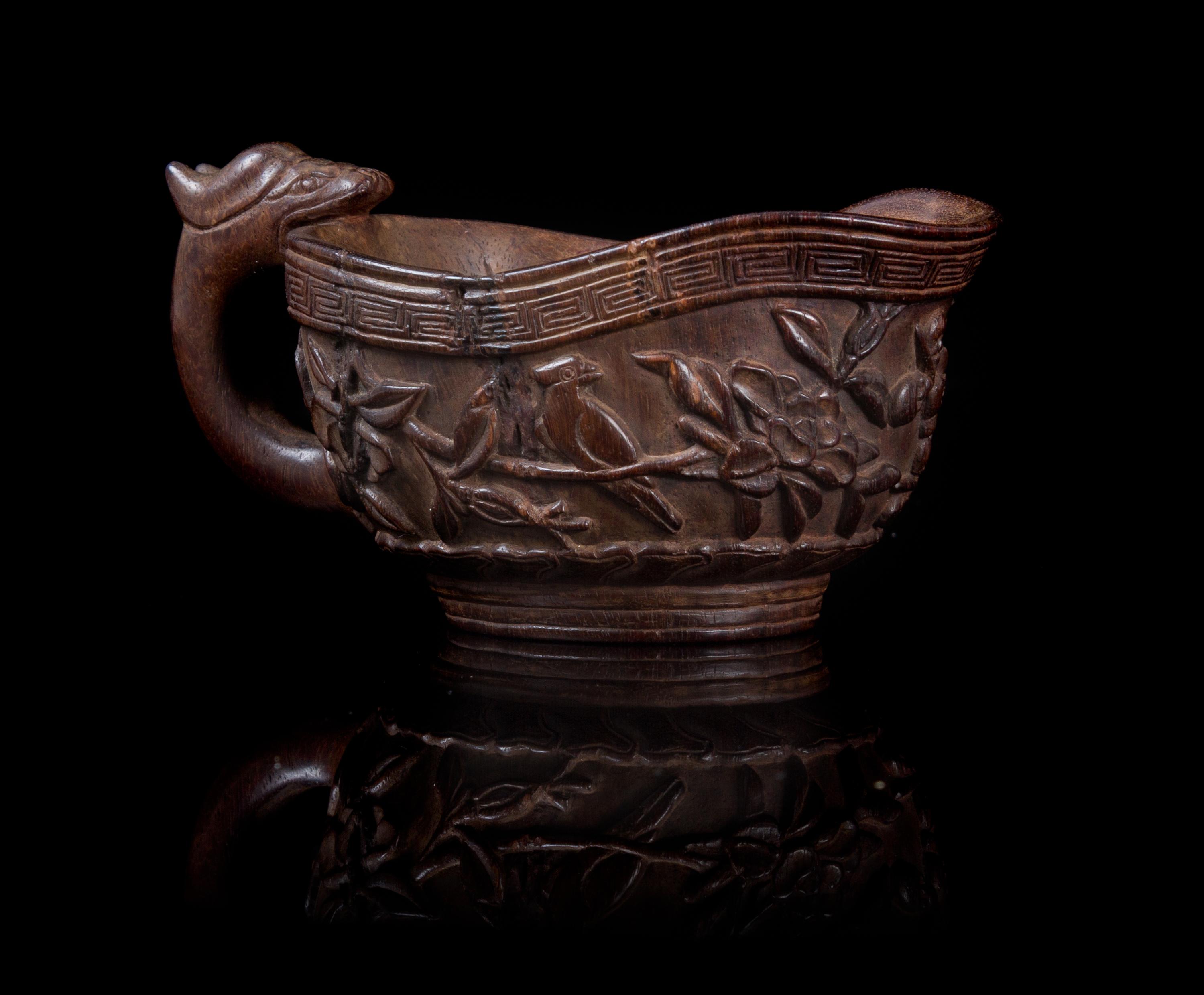 A Zitan Libation Cup Height 2 1/4 x width over handles 4 3/8 inches.