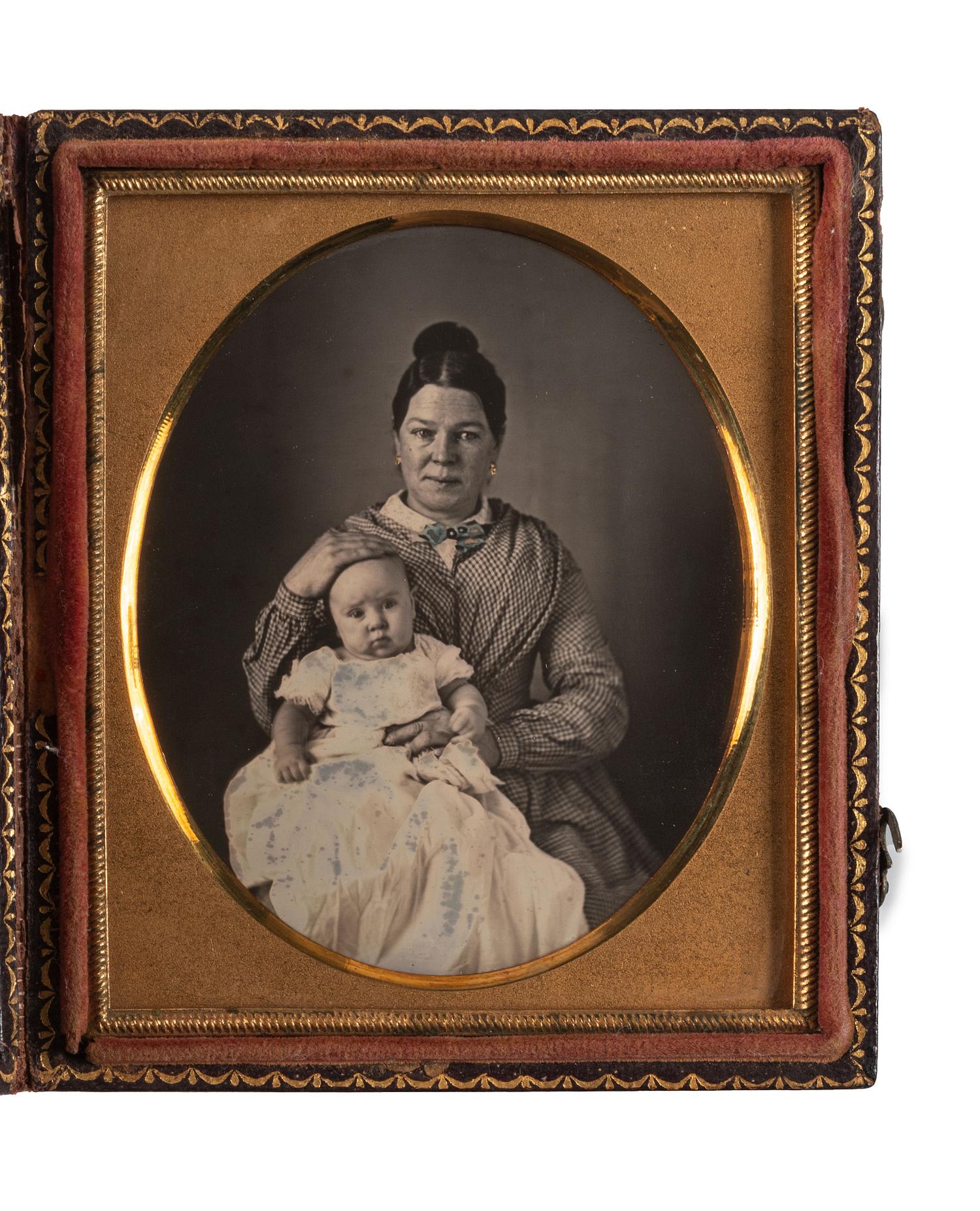 [EARLY PHOTOGRAPHY]. A group of 4 daguerreotype and ambrotype portraits of babies and children, highlighted by a fine daguerreotype featuring a mother and her child, comprising: