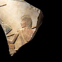 An Egyptian Painted Limestone Relief Fragment