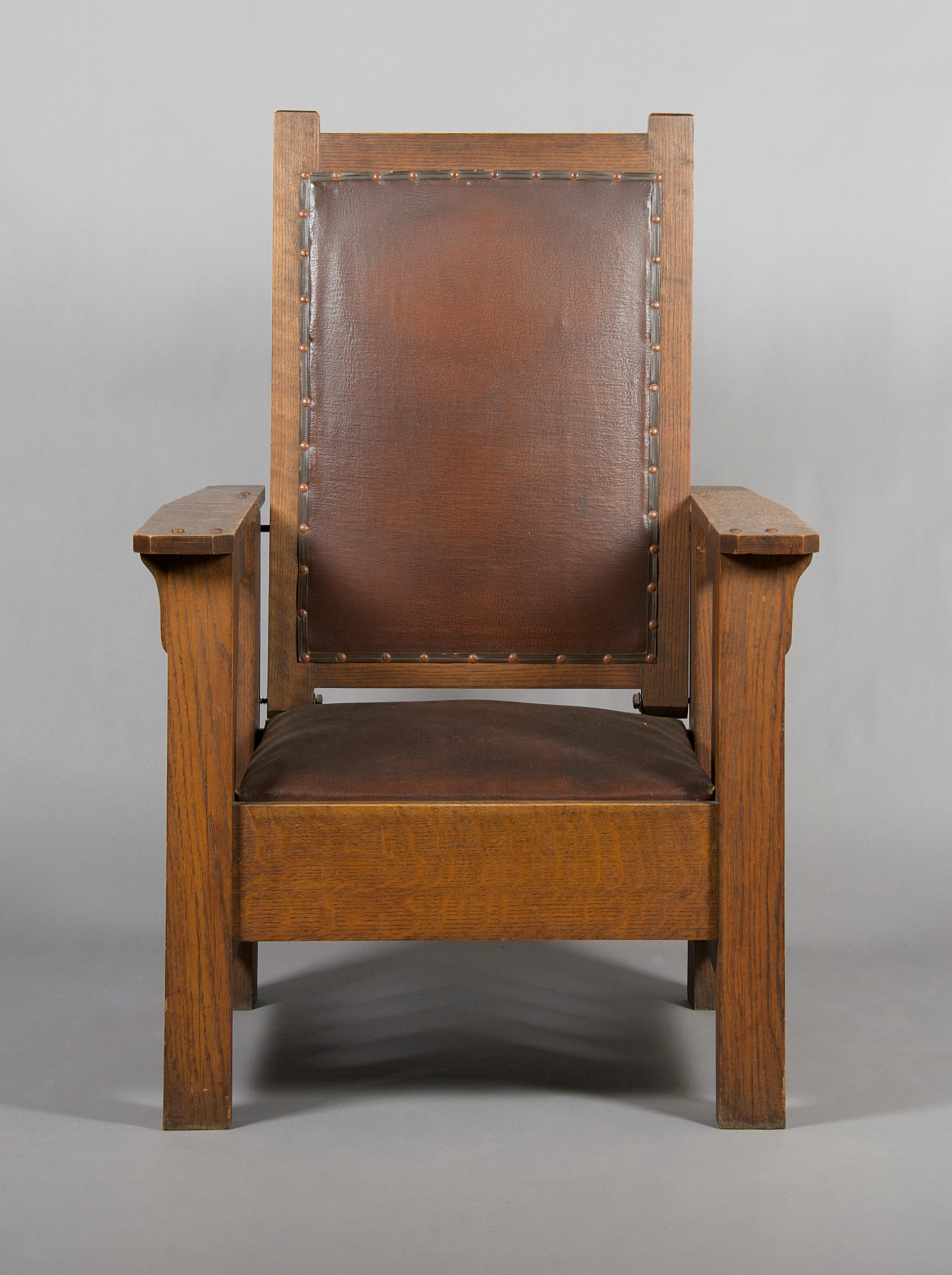 An American Arts & Crafts Oak Morris Chair, Height 45 3/4 inches.