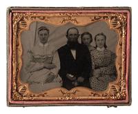 [EARLY PHOTOGRAPHY]. Quarter plate tintype family portrait taken in an outdoor studio tent.