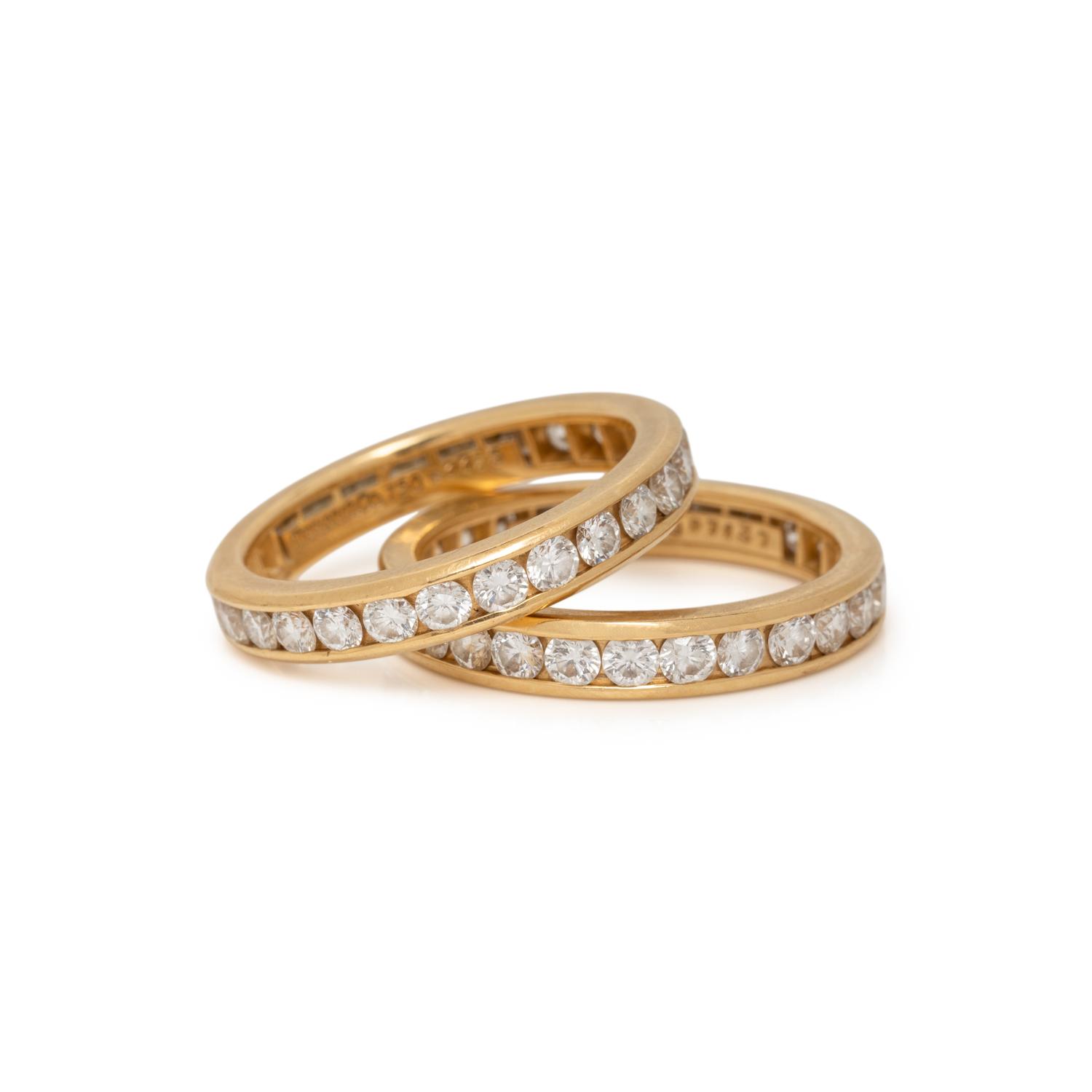 TIFFANY & CO., PAIR OF YELLOW GOLD AND DIAMOND ETERNITY BAND RINGS