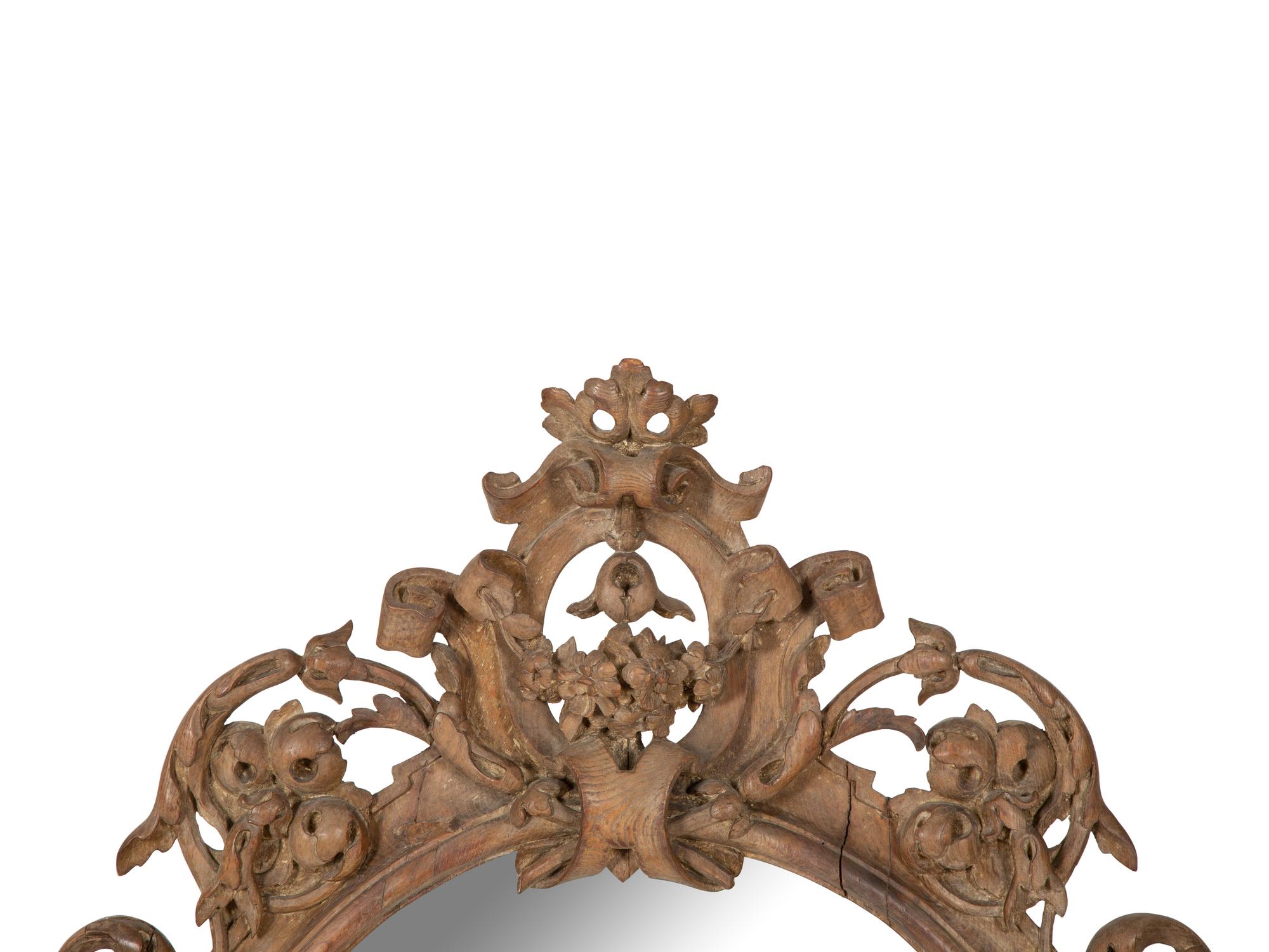 An Italian Baroque Style Carved Walnut Mirror