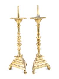 A Pair of Spanish Brass Triangular-Base Pricket Sticks