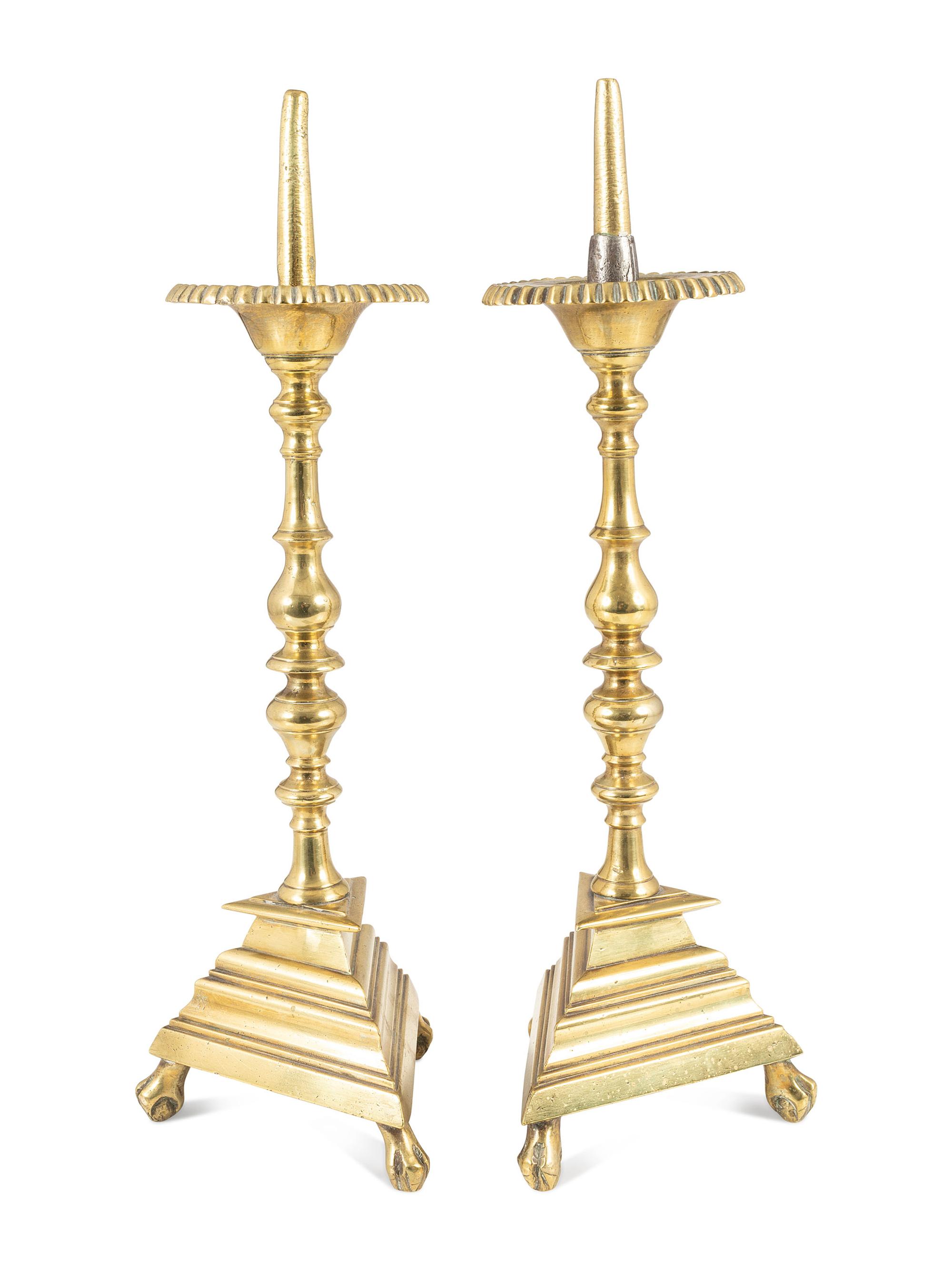 A Pair of Spanish Brass Triangular-Base Pricket Sticks