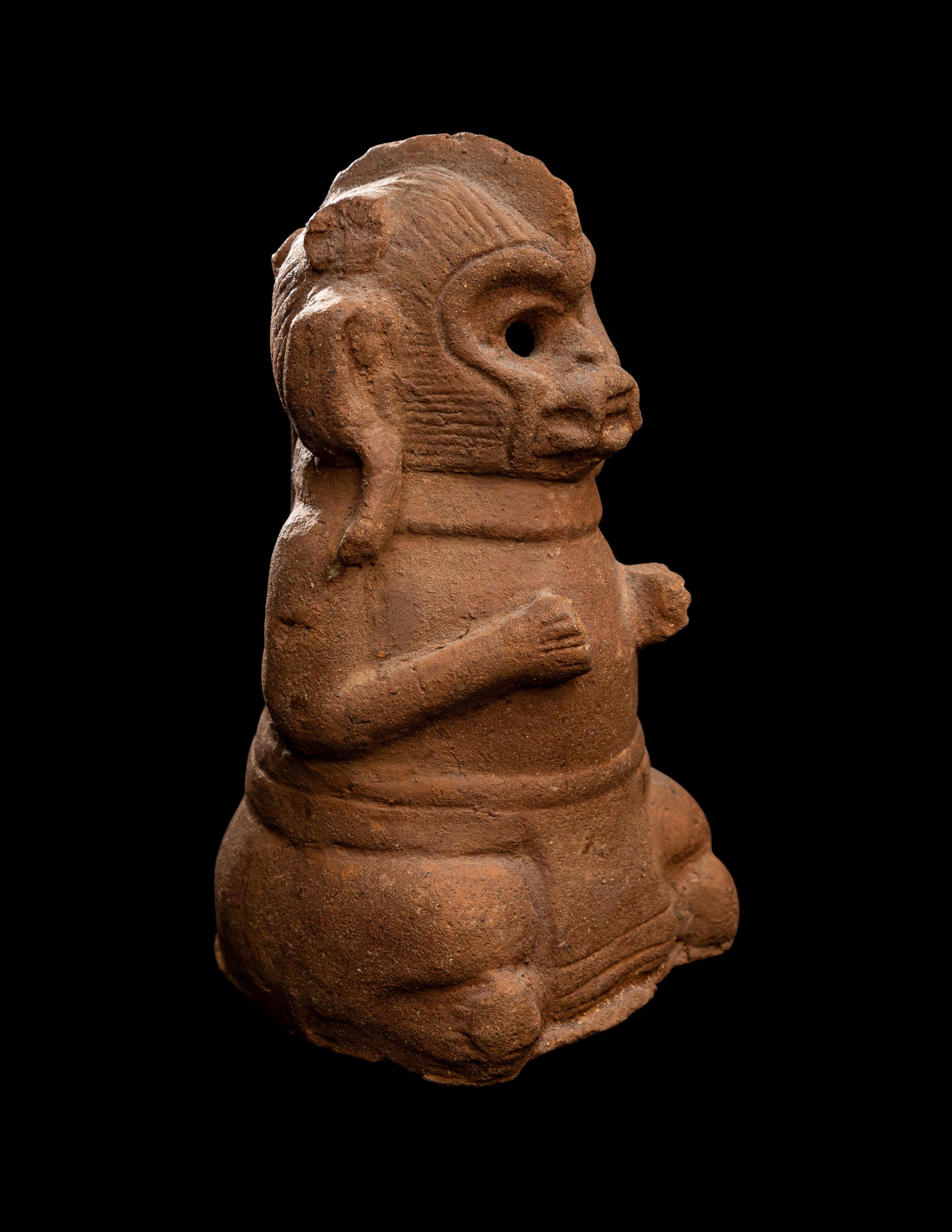 A Maya Figurine of a Seated Monkey