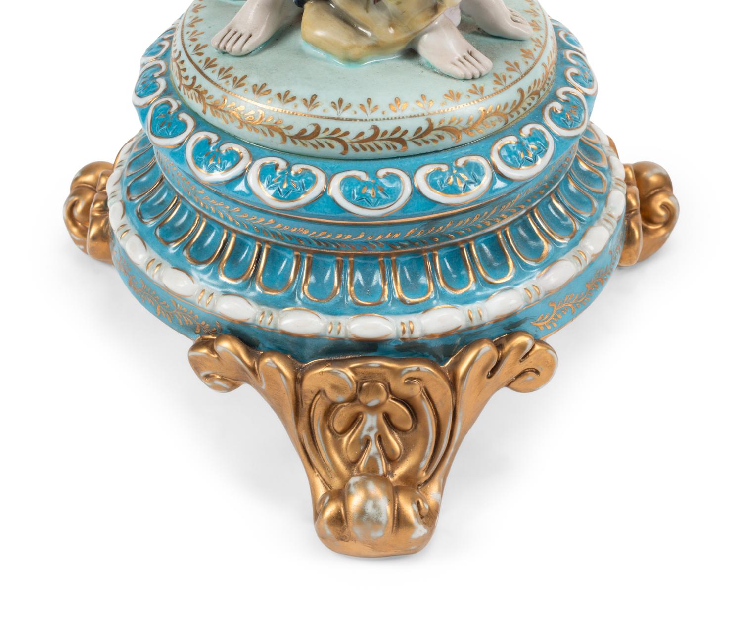 A Pair of Gilt Metal and Porcelain Figural Four-Light Candelabra
