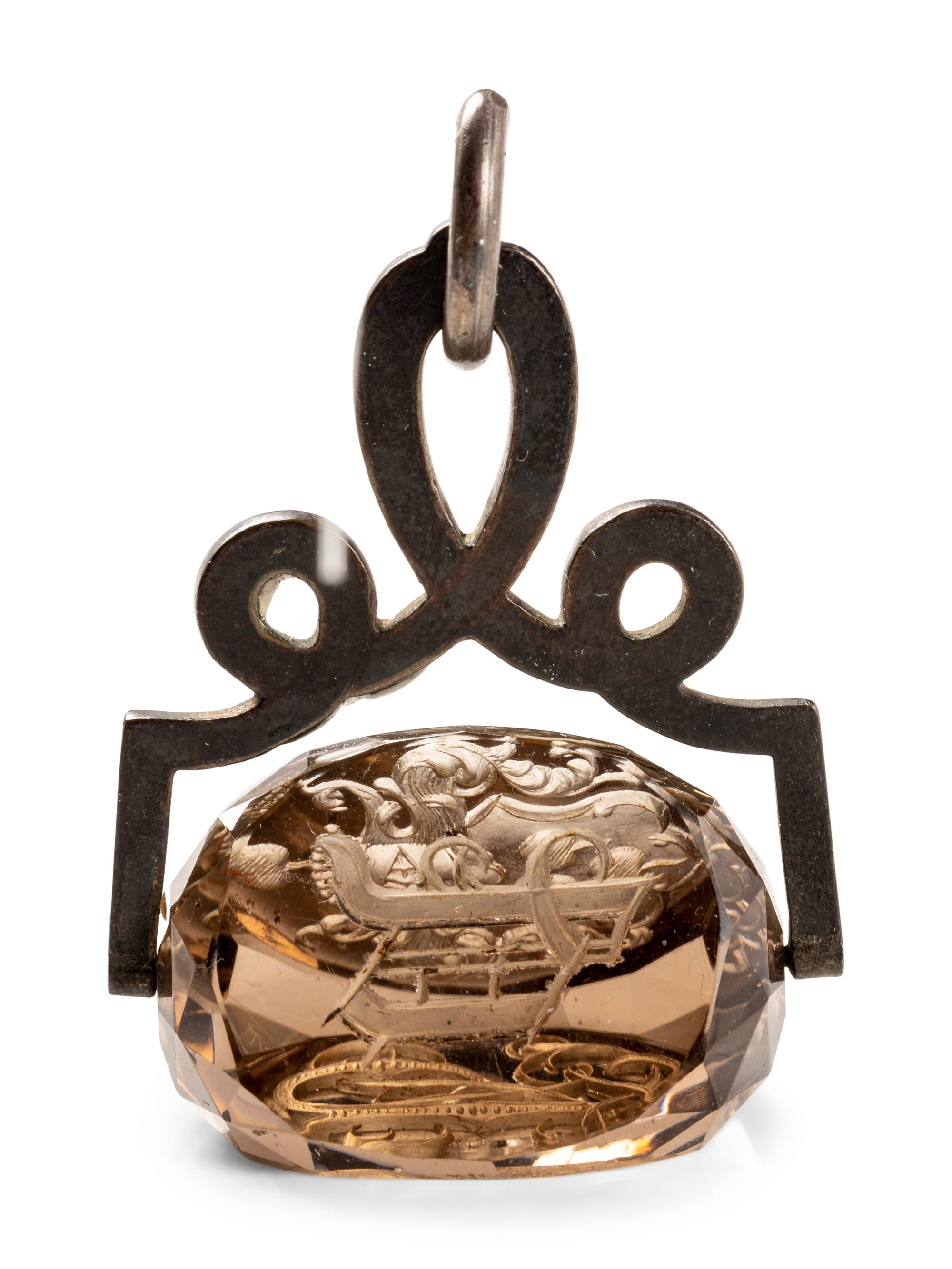 A German Carved Topaz and Gilt Metal Mounted Hand Seal