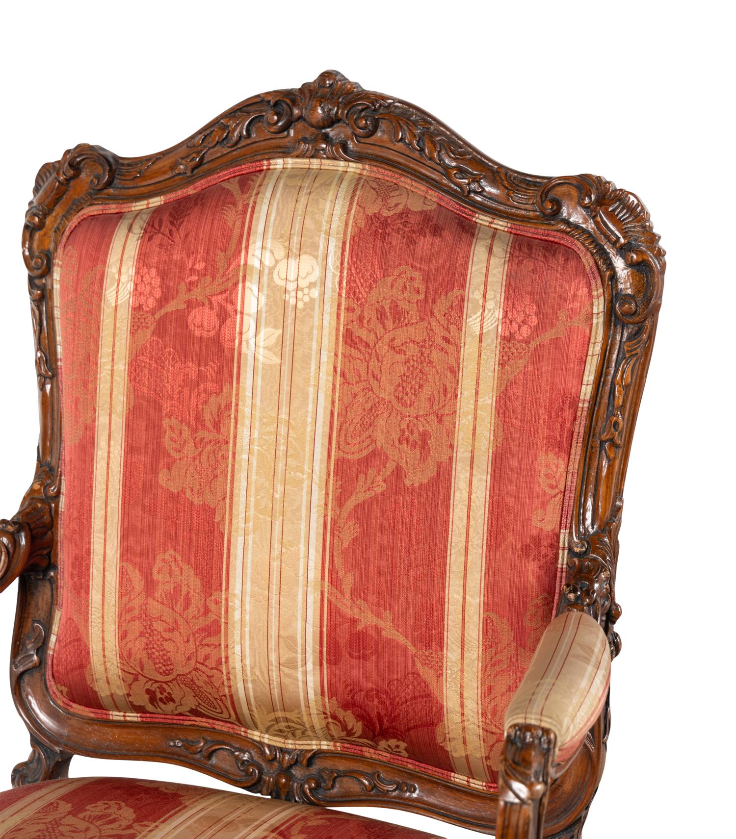 A Pair of Louis XV Style Walnut Fauteuils