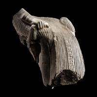 An Egyptian Limestone Fragment of a Seated Scribe