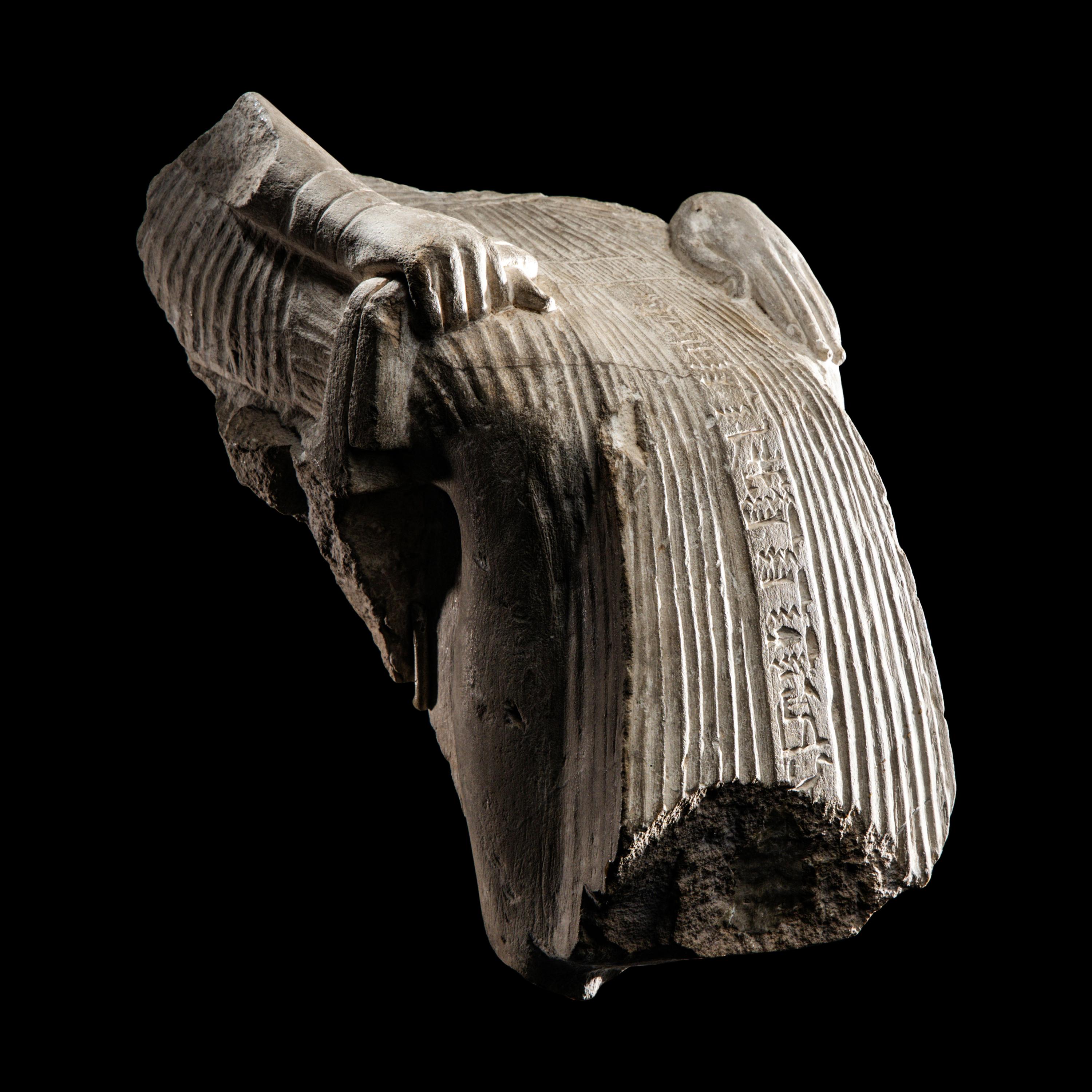 An Egyptian Limestone Fragment of a Seated Scribe
