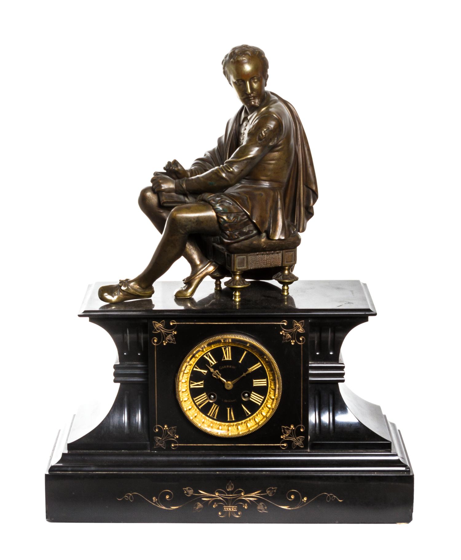 A French Gilt Bronze and Slate Figural Mantel Clock, Height 21 inches.