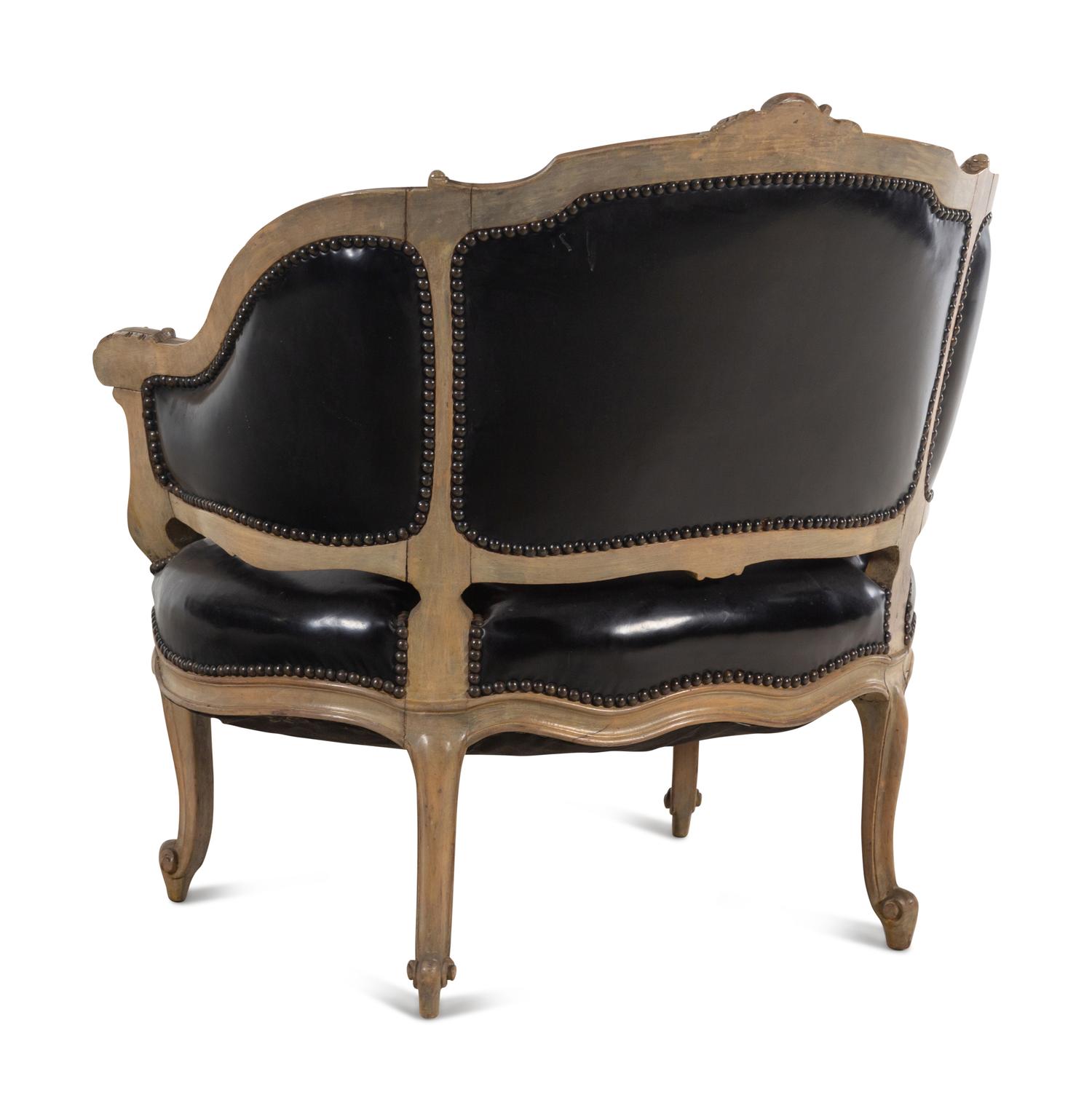 A Louis XV Style Painted and Black Leather Upholstered Bergère